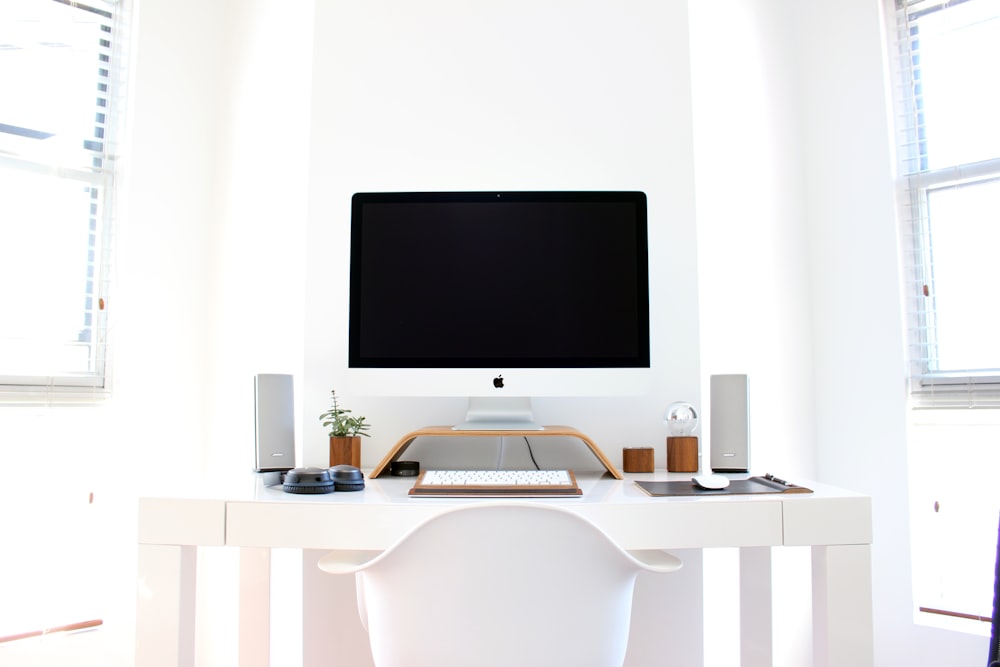iMac on top of table