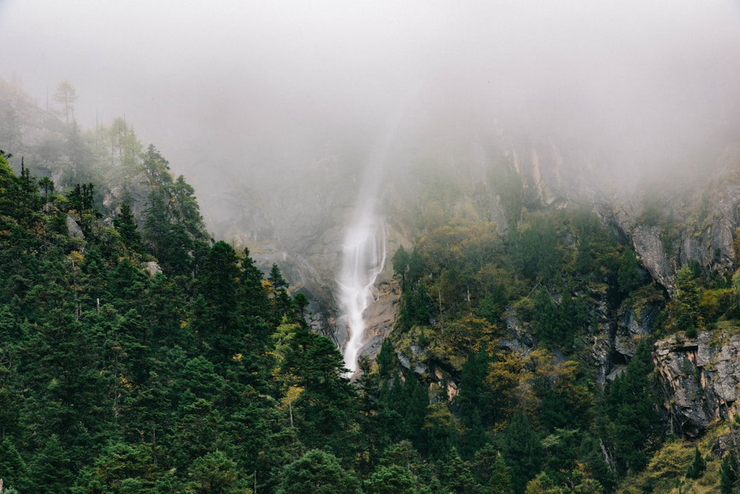 Waterfall on a misty rock face