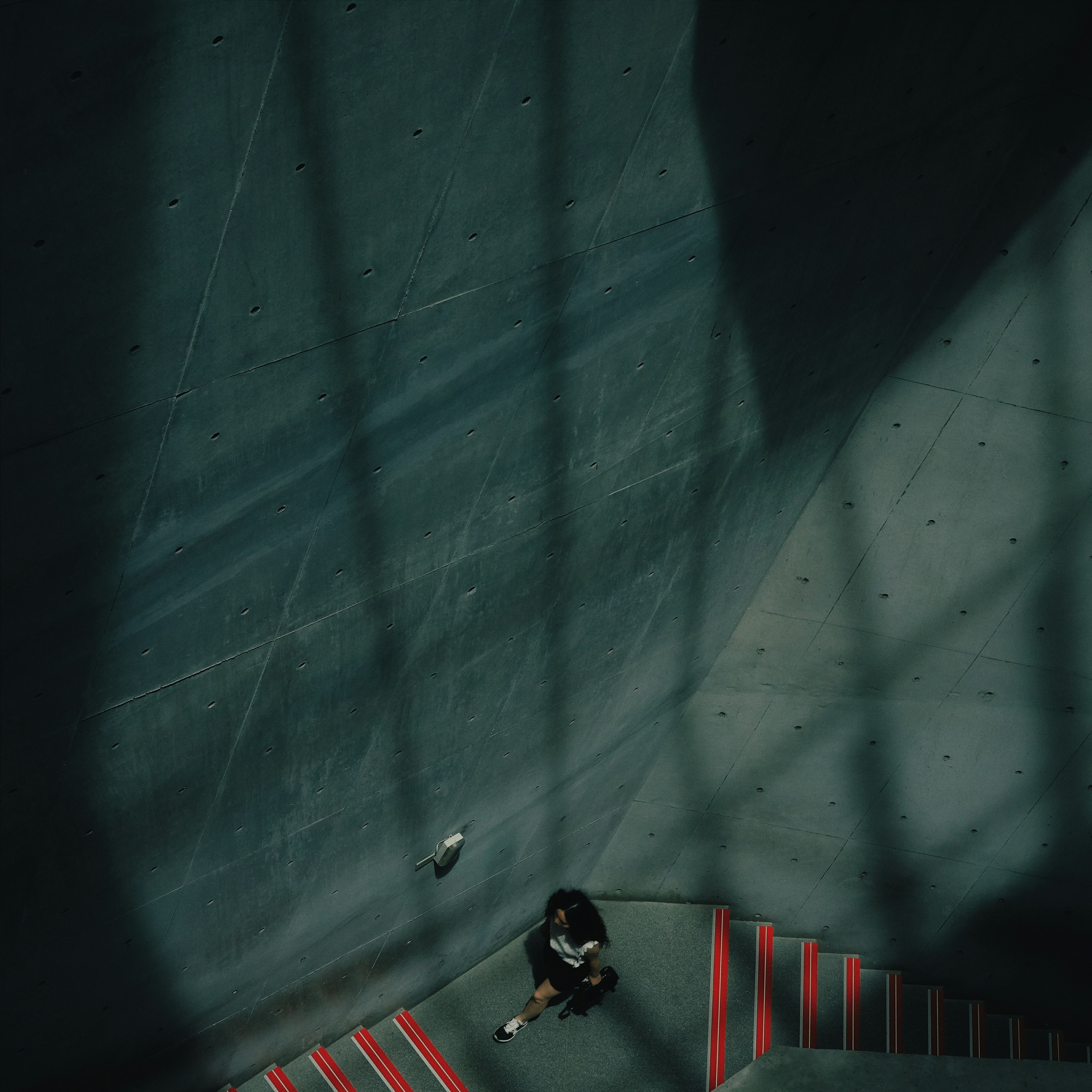 aerial photography of couple kissing in stair