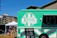 A smiling customer standing next to a Frostline refrigerated trailer at an outdoor event in Los Angeles.