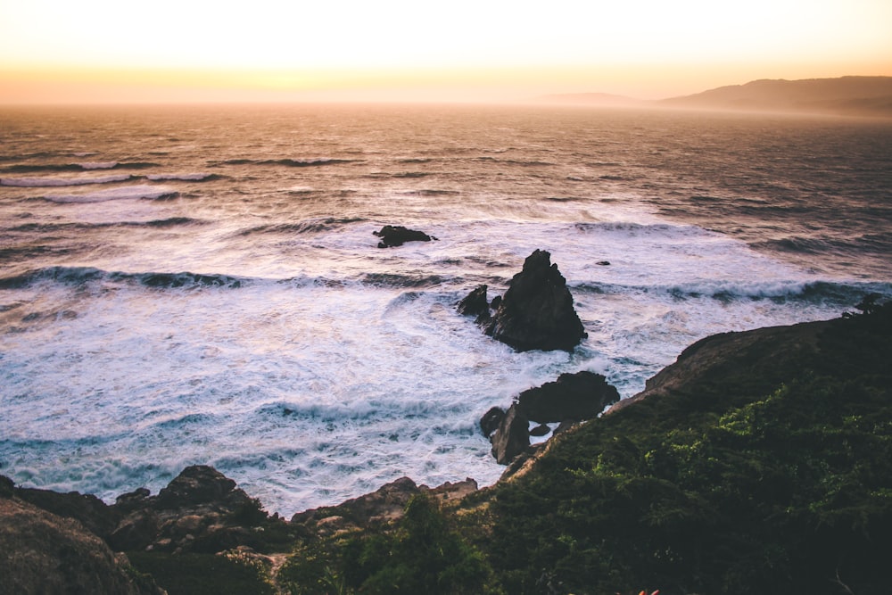 photo of sea shore with rocks