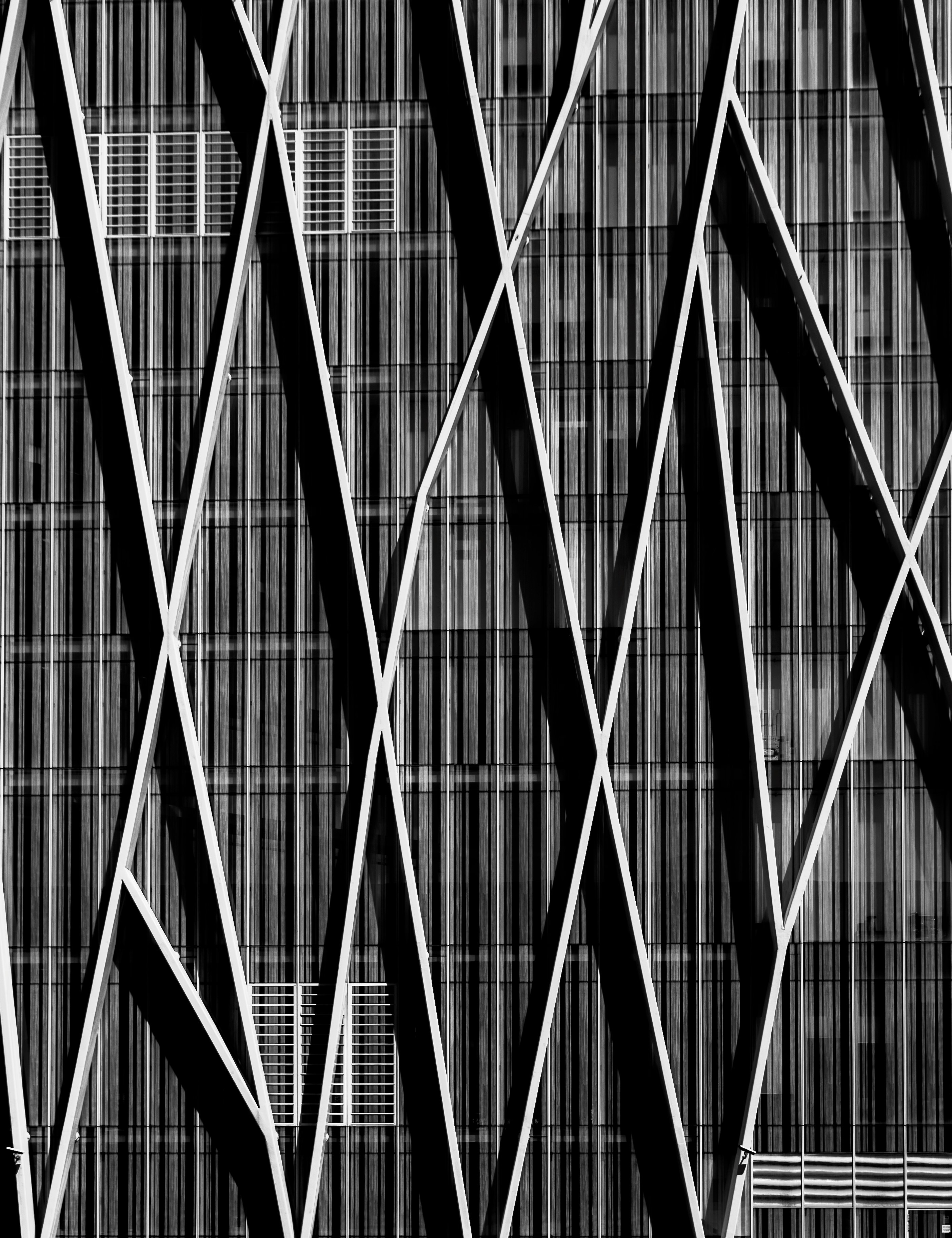 Black and white shot of building wall with modern abstract design and lines in Barcelona