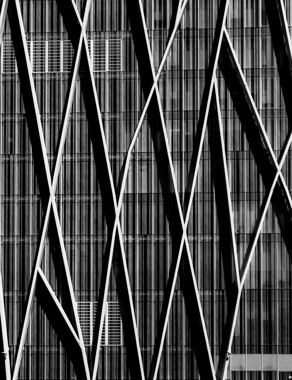 Black and white shot of building wall with modern abstract design and lines in Barcelona