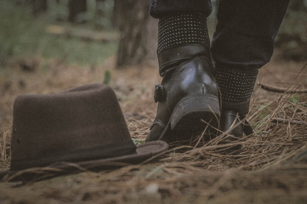 brown bucket hat on ground close-up photography