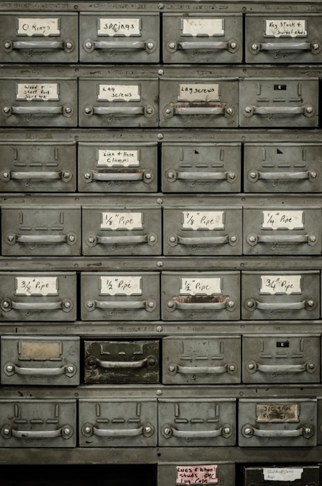 Organized filing cabinet drawers representing document indexing and data retrieval systems
