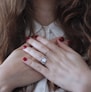 woman wearing silver-colored ring