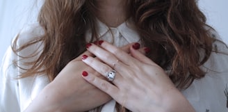 woman wearing silver-colored ring