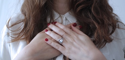 woman wearing silver-colored ring