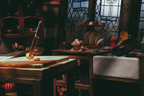 Rustic kitchen scene featuring a thick wooden cutting board with a smooth epoxy resin accent, surrounded by fresh vegetables