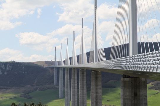 Pan Borneo bridge stretching over a lush river valley with construction details visible.