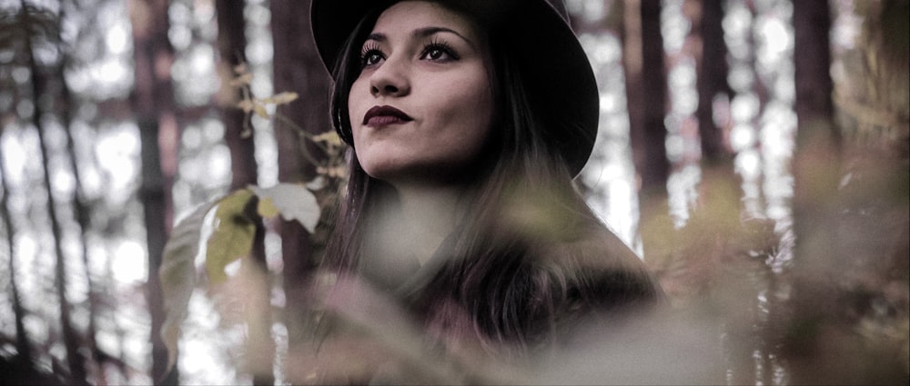 women wearing black hat close-up photography