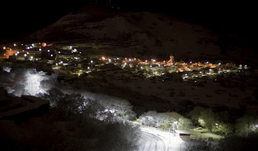 A small village in India illuminated at dusk by solar-powered streetlights.