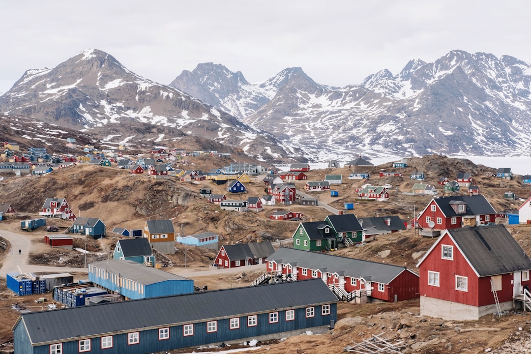 houses on brown hill during daytime