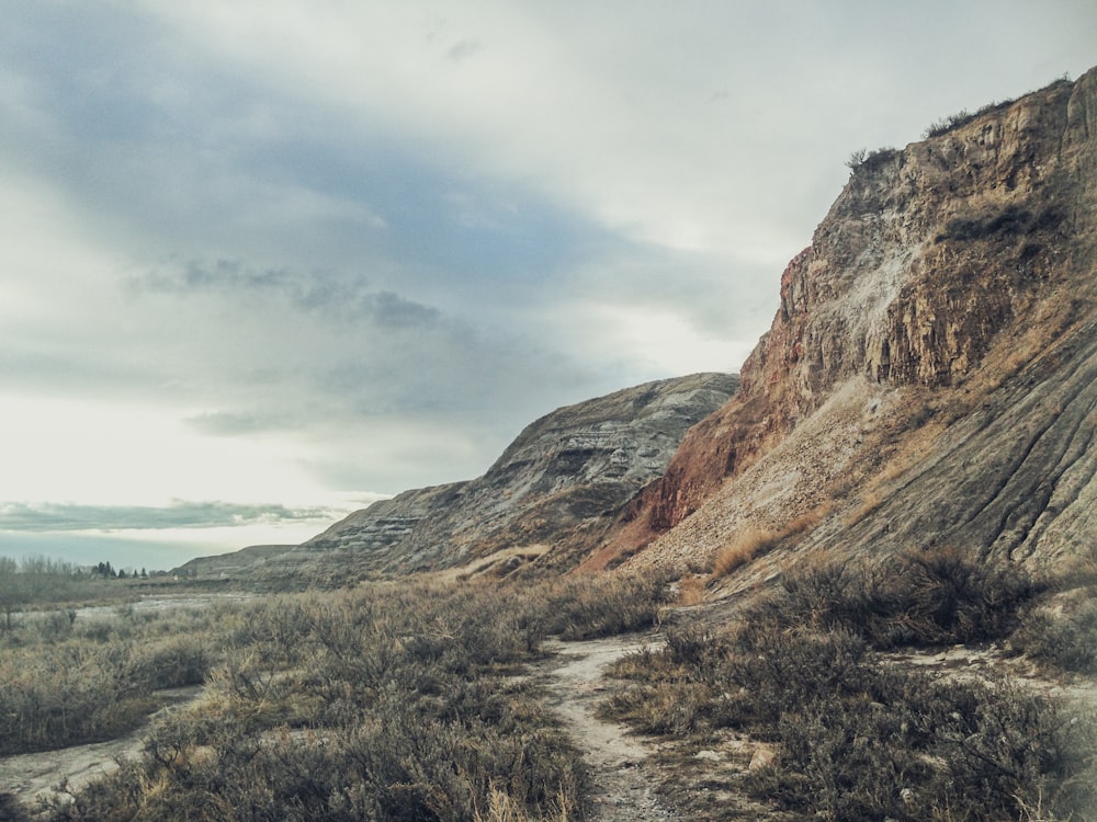 dirt road beside cliff