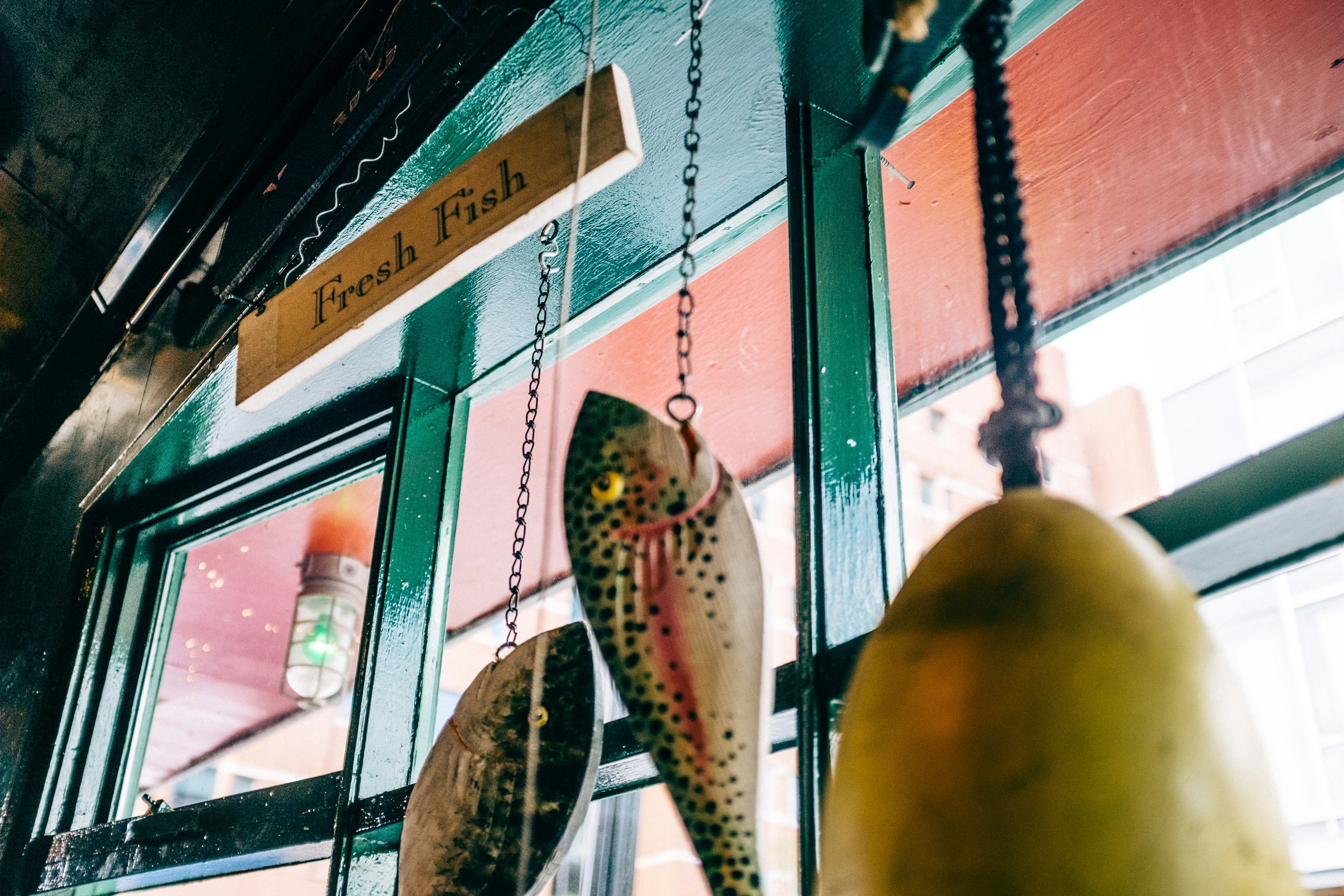 Rustic restaurant signage with fish decor