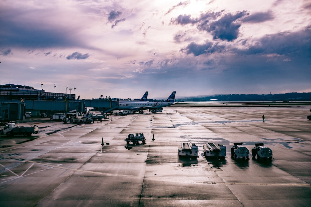 white airplane on gray concrete ground during daytime