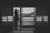 A mountain landscape in Japan with a hiker checking their phone using esim japan service.