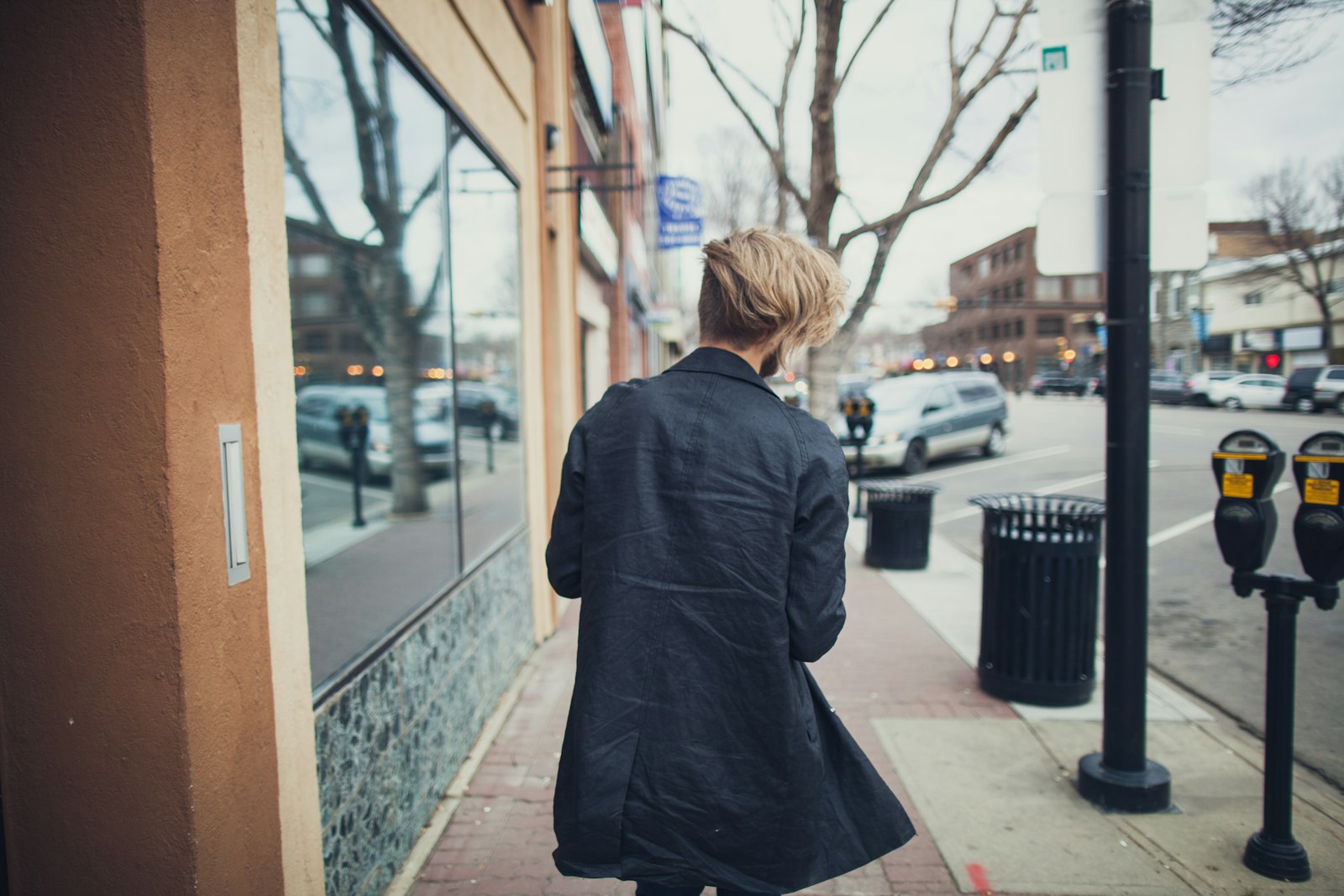 Canon EOS 5D Mark II + Canon EF 24mm F1.4L II USM sample photo. Person walking beside street photography