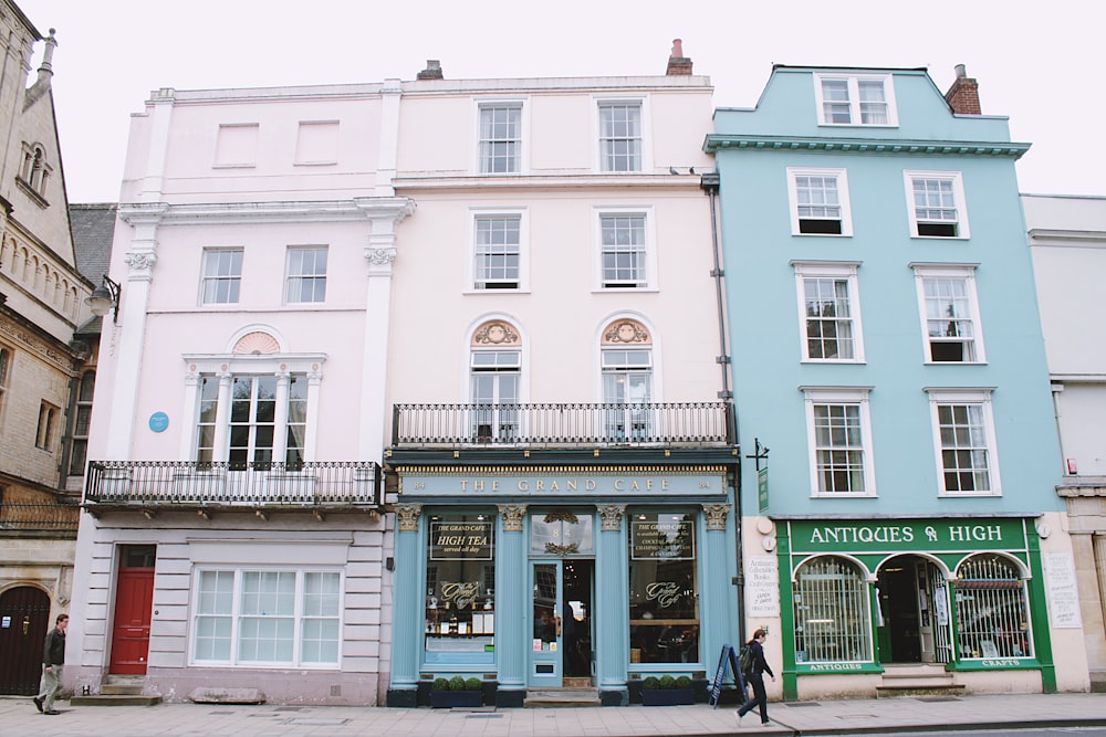 white and blue 4-storey house