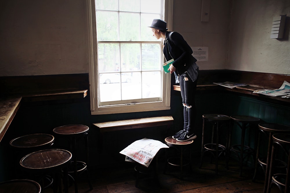 man standing near the window