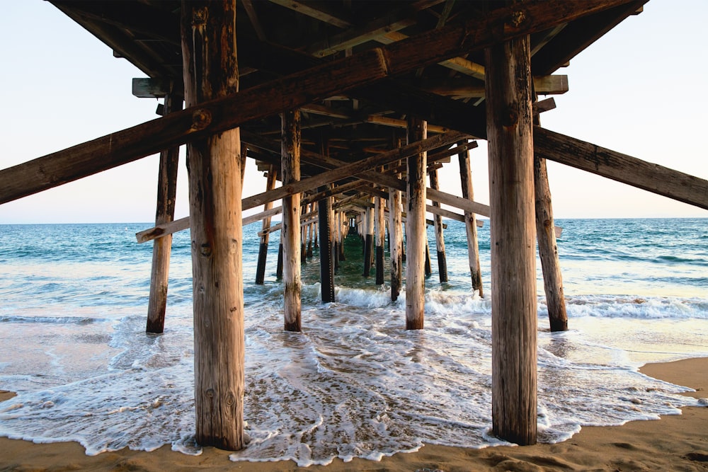 brown wooden dock on sea during daytime