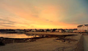 Cozy seaside resort at sunset inviting travelers to relax.