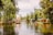 A serene scene of colorful boats floating along a river, surrounded by lush greenery. The boats have vibrant decorations and are reminiscent of traditional Mexican designs. There are people on the boats, enjoying a leisurely ride, and the water reflects the greenery and boat colors.