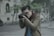 shallow focus photography of man taking photograph holding his camera