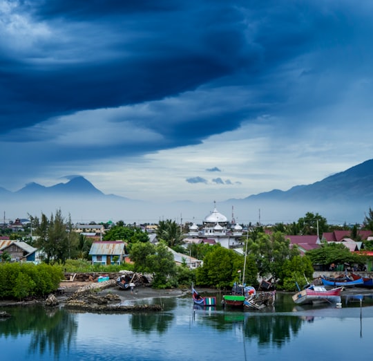 landscape photo of house surrounded by trees in Banda Aceh Indonesia