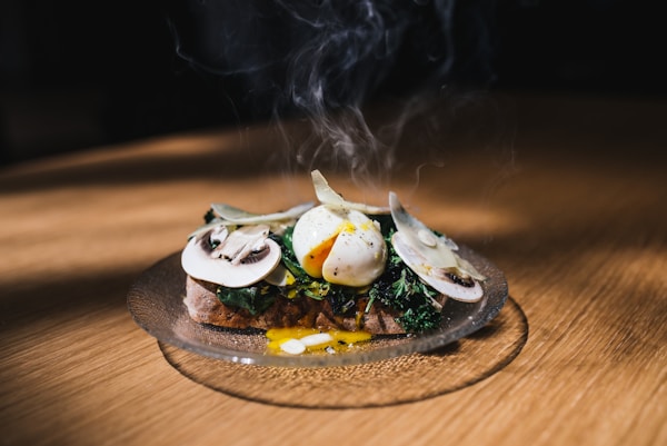 Meat with egg and vegetable on top