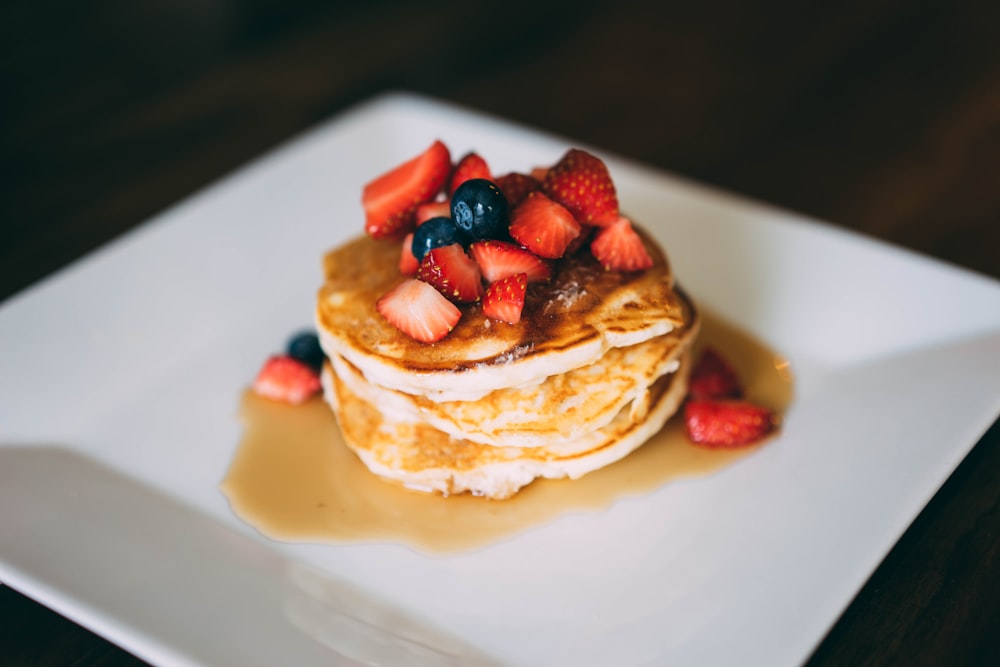 sliced strawberries on pan cake