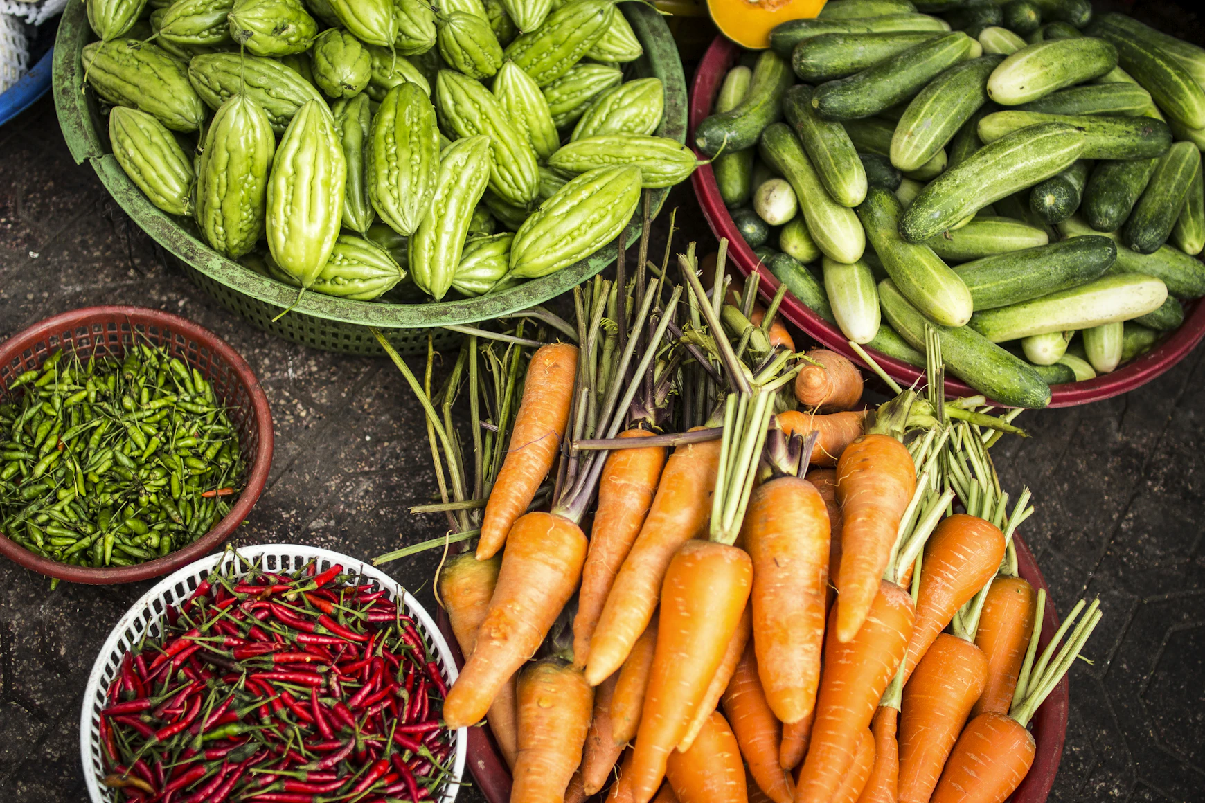 Freshly harvested organic
    vegetables like okra and chillies from an Indian garden