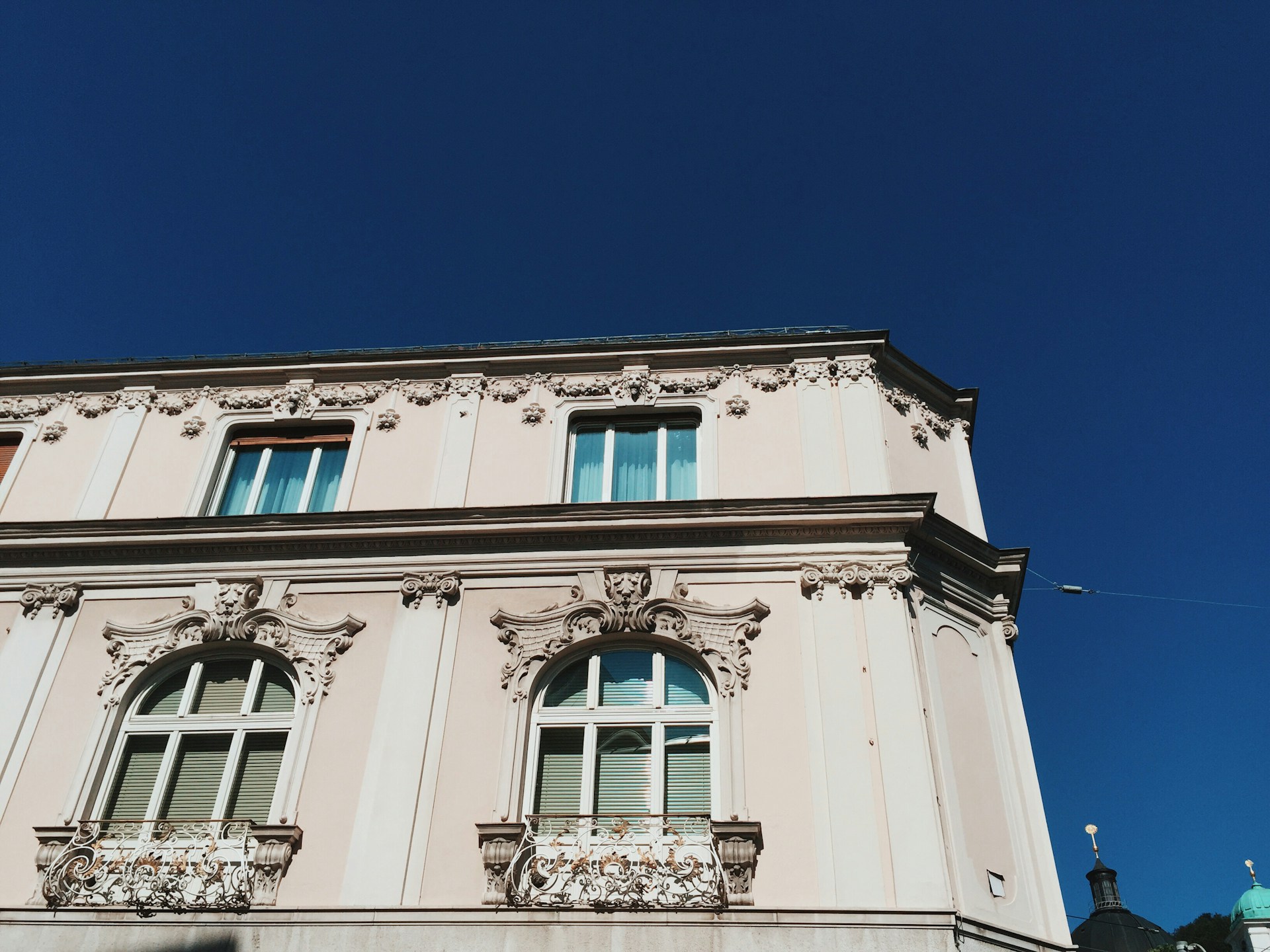 An elegant building facade with intricate details and a harmonious color palette.