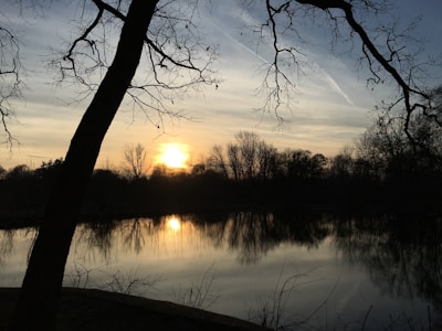 A serene sunset over a quiet lake, symbolizing peace and reflection.