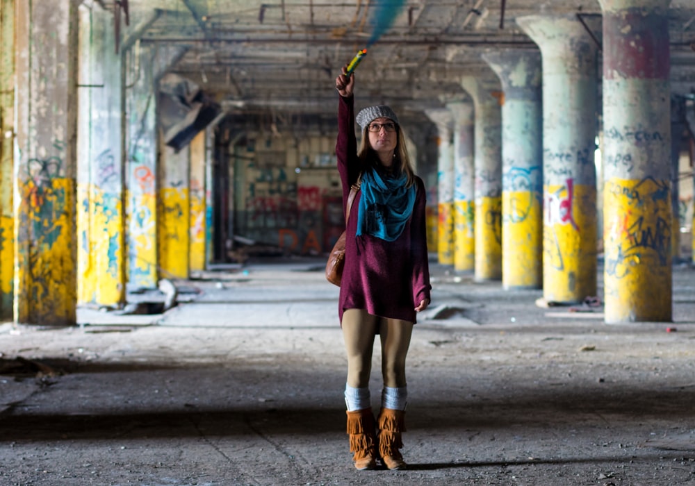 woman standing on gray pavement