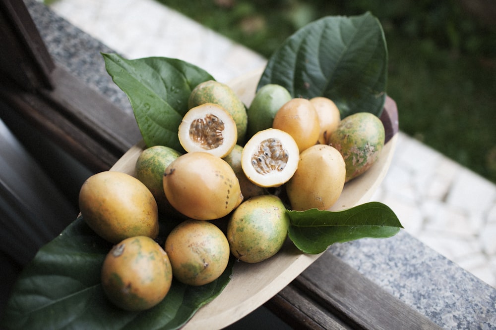 orange fruits on brown tray