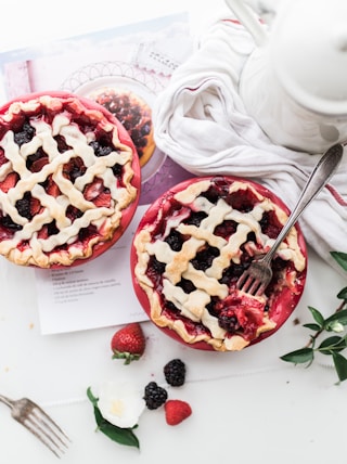 baked pie near white ceramic teapot