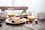 slice fruits on plate on near glass cups