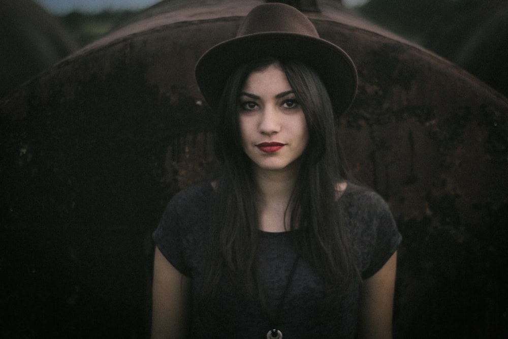 woman wearing gray t-shirt and velvet hat