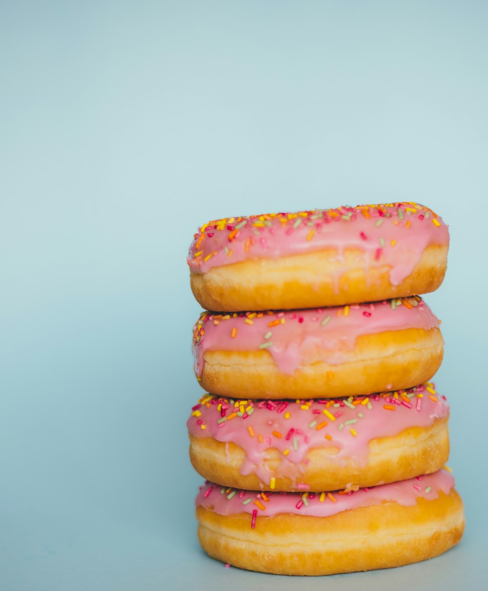 four donuts with sprinkles