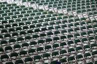 Rows of Arabic seats lined up neatly in a large event hall, ready for a festive occasion.