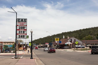 A split screen showing two different towns with grocery prices and rent trends