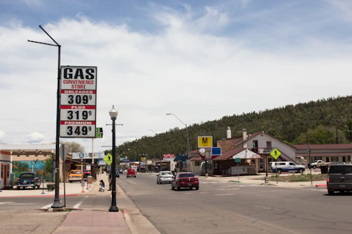A split screen showing two different towns with grocery prices and rent trends