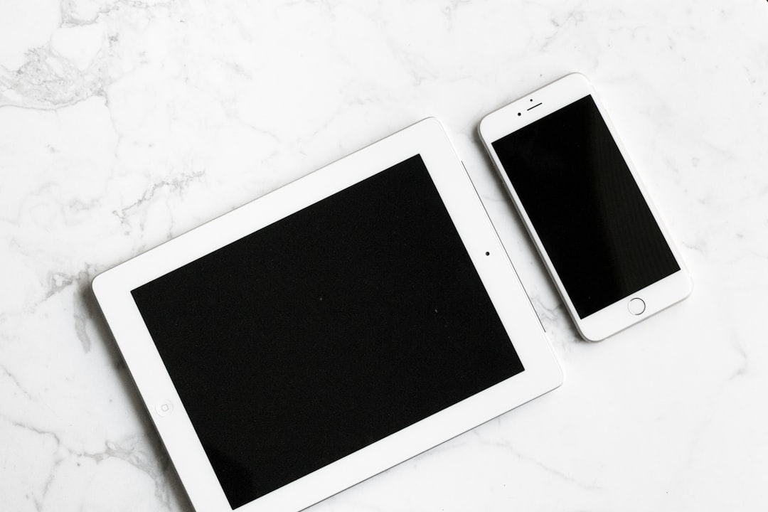 white iPad and silver iPhone 6, monochrome tablet smartphone