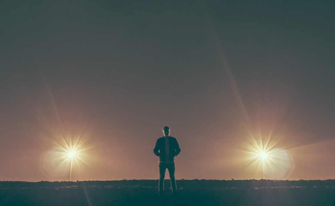 man standing in the middle of nowhere