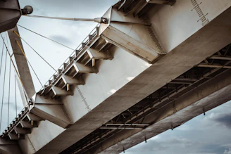 A detailed blueprint of a modern bridge design with technical annotations