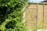 A beautifully installed wooden fence in a residential backyard.
