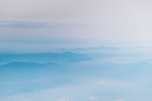 mountain covering with clouds