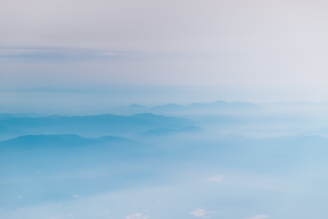 mountain covering with clouds