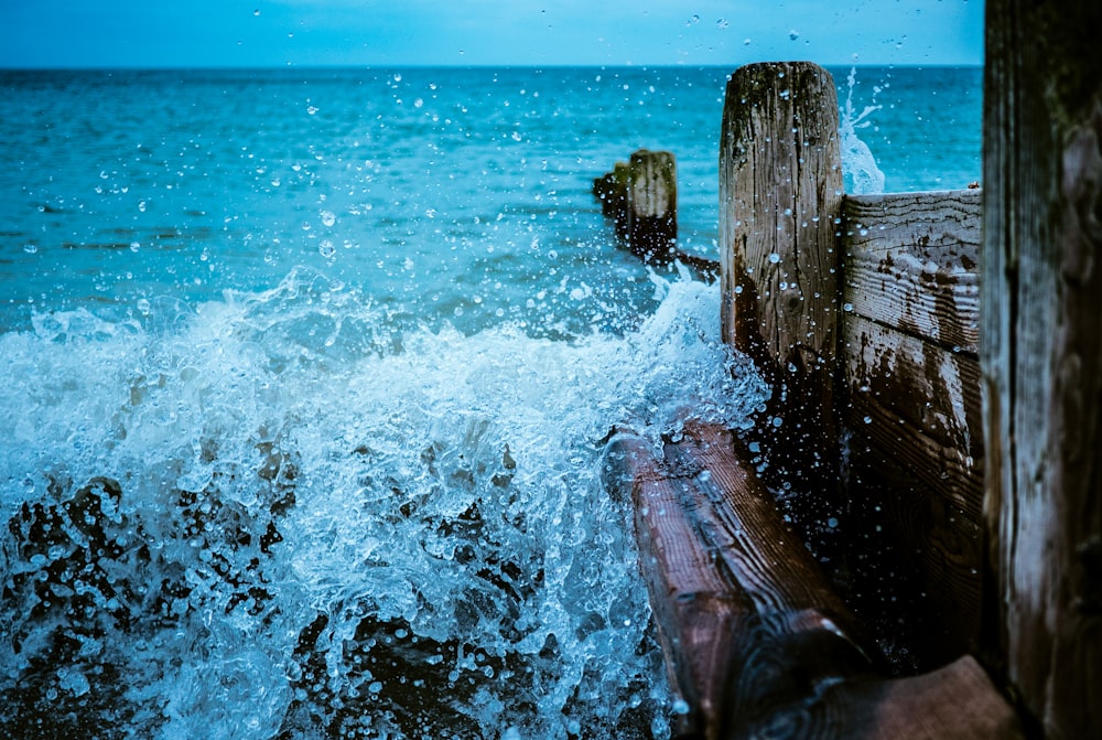 brown wooden dock with body of water during daytime